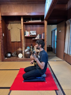 Me playing Sanshin in Heshikiya